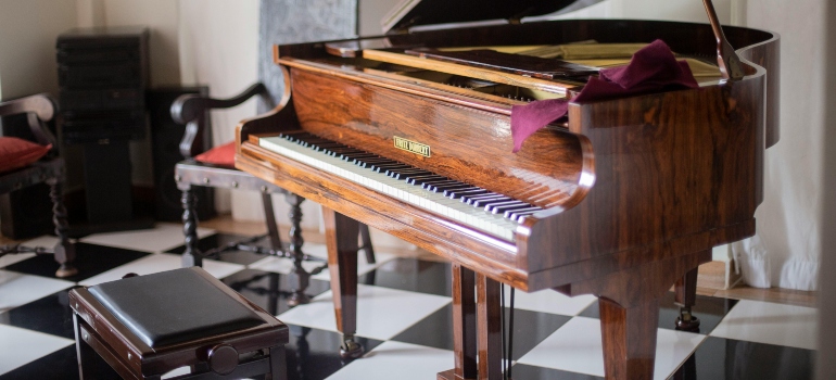 Luxurious grand piano in a vintage room, relocated flawlessly by piano movers Virginia.
