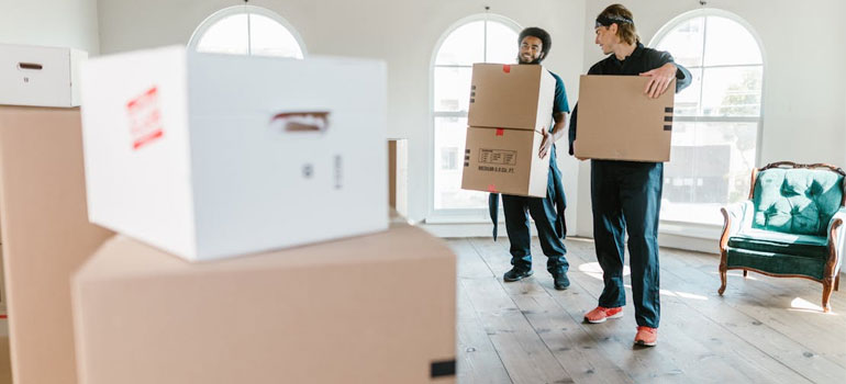 two movers with moving boxes