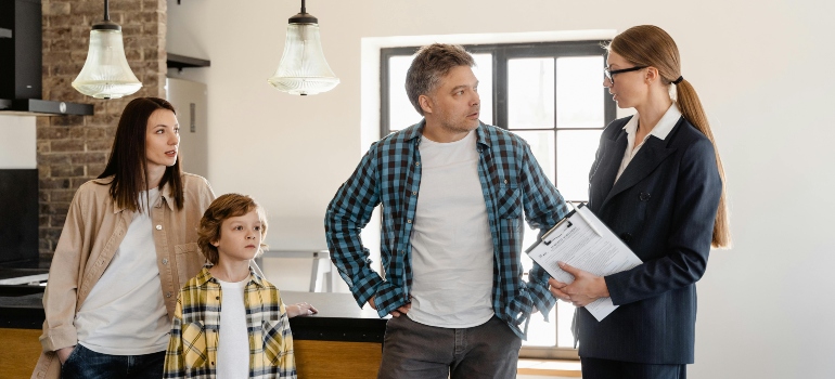 A Family Man Talking to the Agent