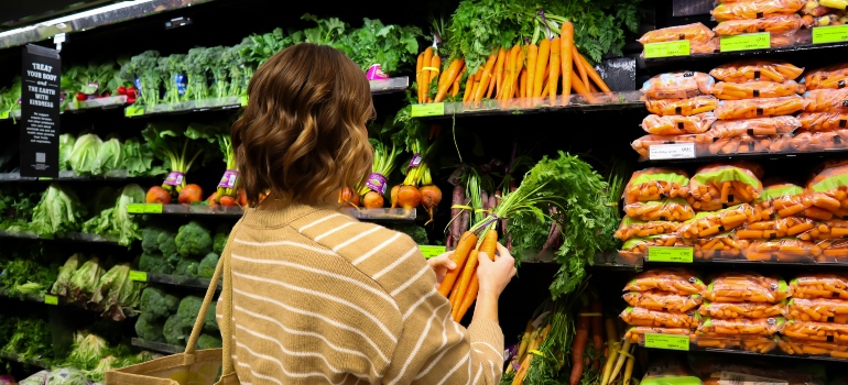 A person shopping for vegetables.