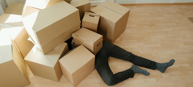 A person drowning in boxes.