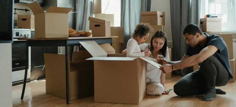 Family unpacking boxes.