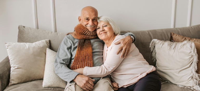 Man and Woman Sitting on Couch