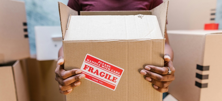 Expert movers in Danville VA packing fragile items with care and precision for a safe move.