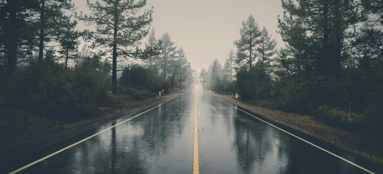 Rainy, winding road in Bedford presenting a common challenge for local movers.
