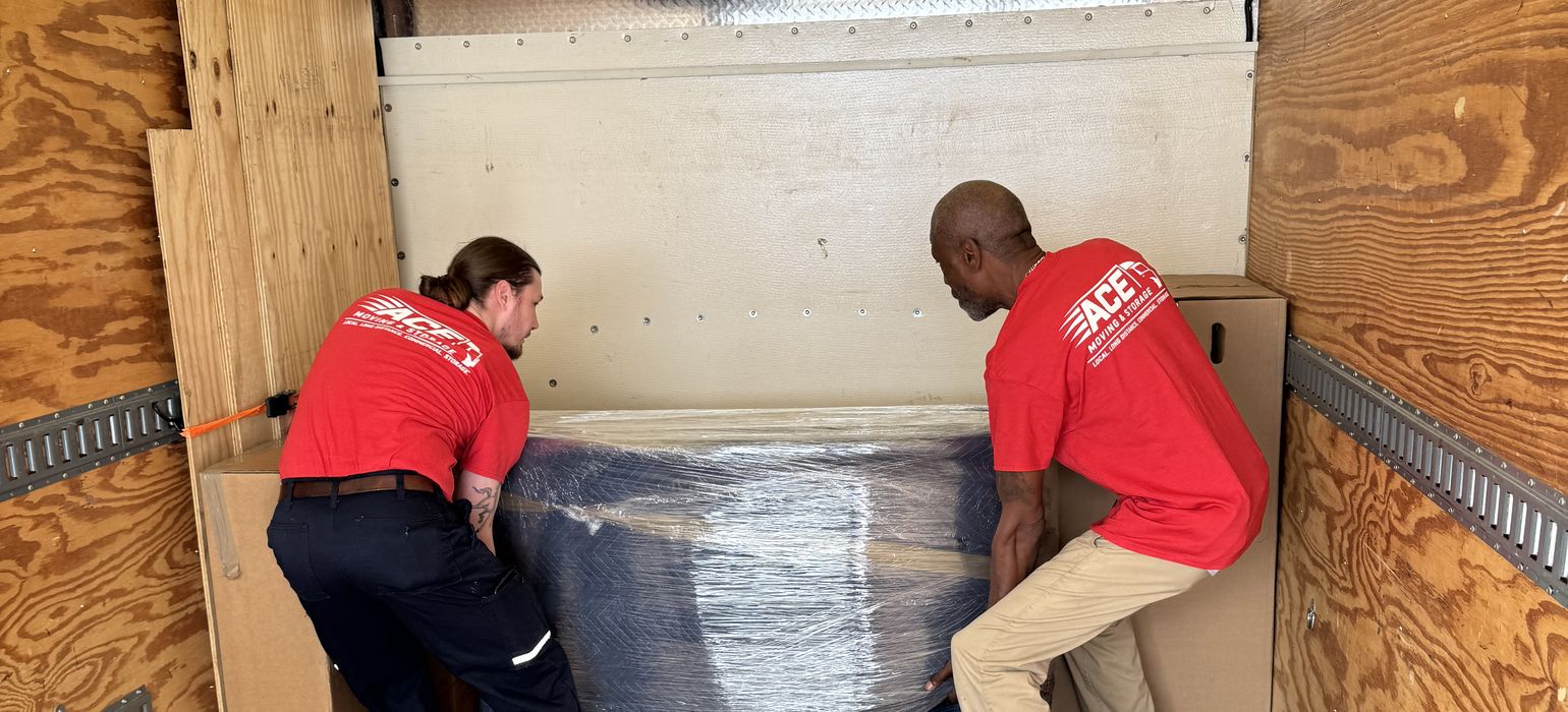 Ace movers loading wrapped furniture into a truck, long distance movers Virginia